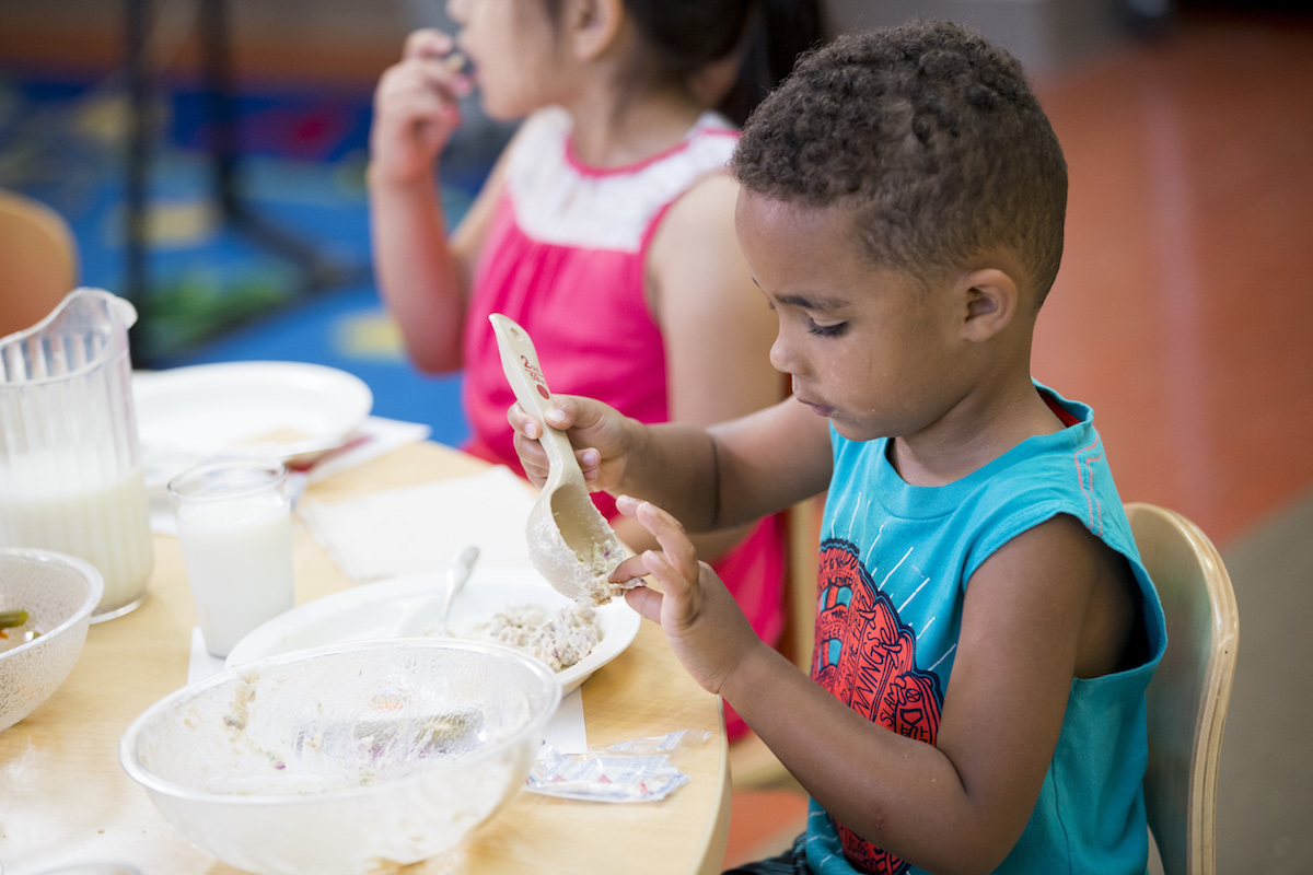 boy eating at table