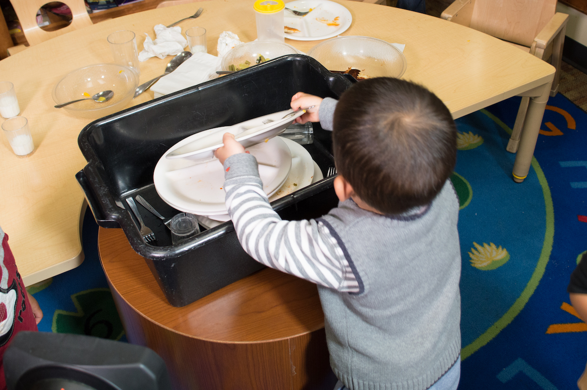 bowl putting plates in washtub