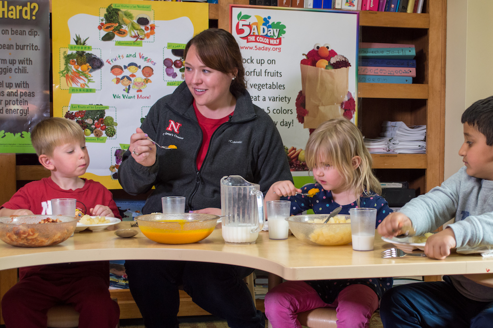 teacher at table with kids